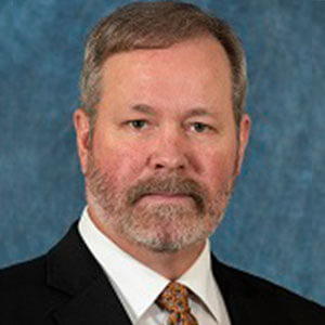 Dr. Bill Angrove's professional headshot.